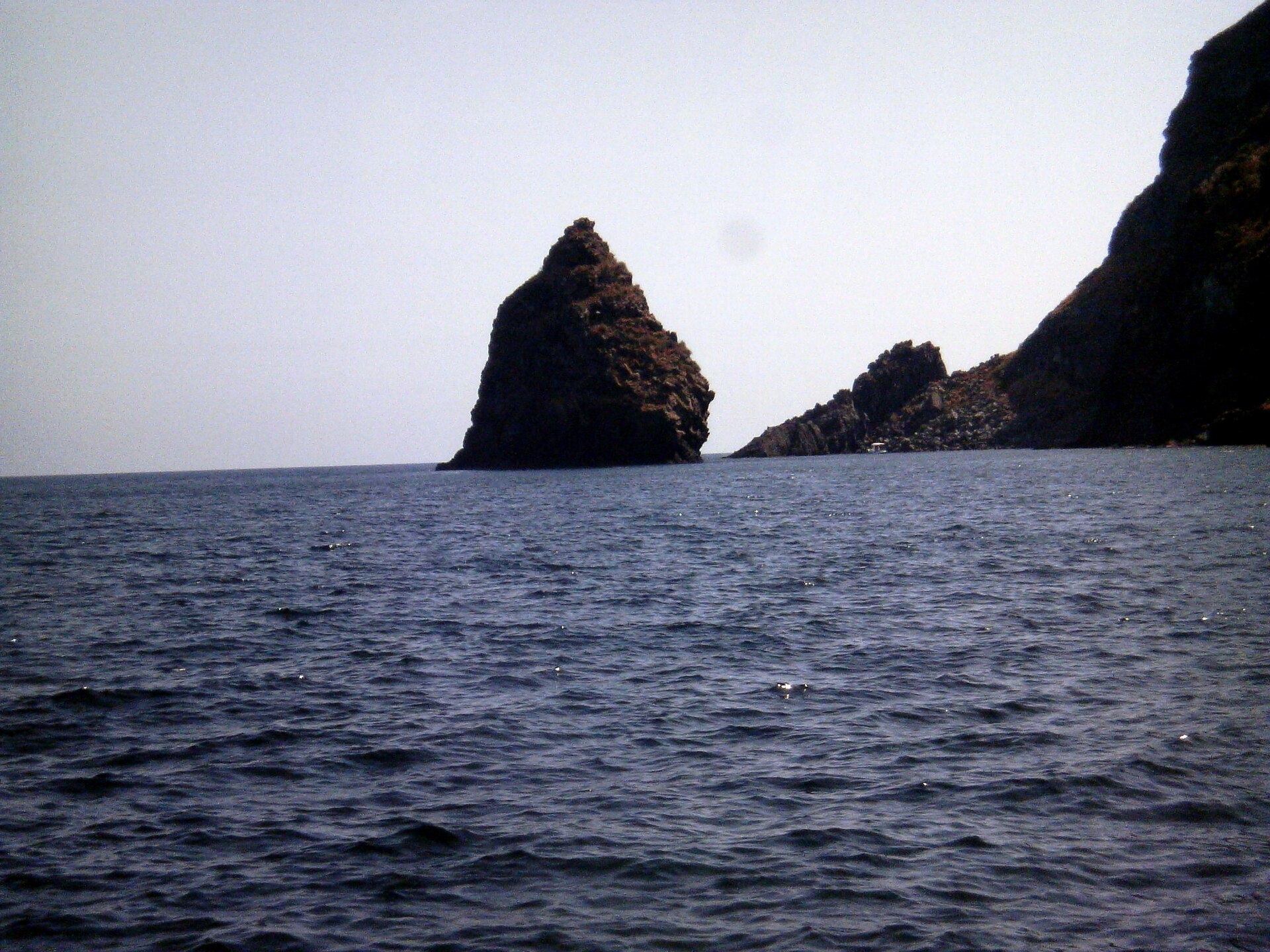 The faraglione sea stack marking Cala Levante on Pantelleria's north-east coast