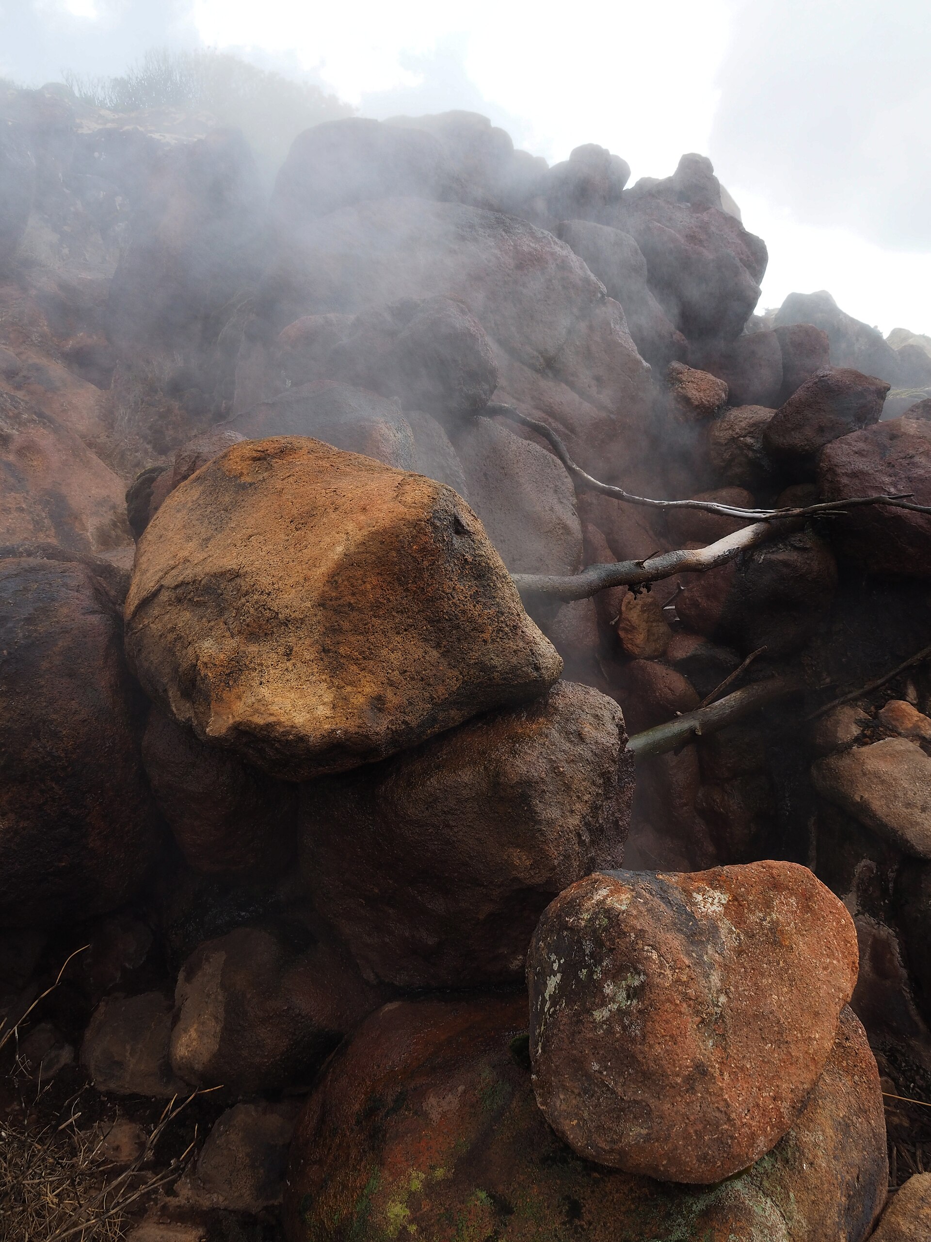 Steam rising from volcanic rocks at the Favare Grande fumarole field on Pantelleria